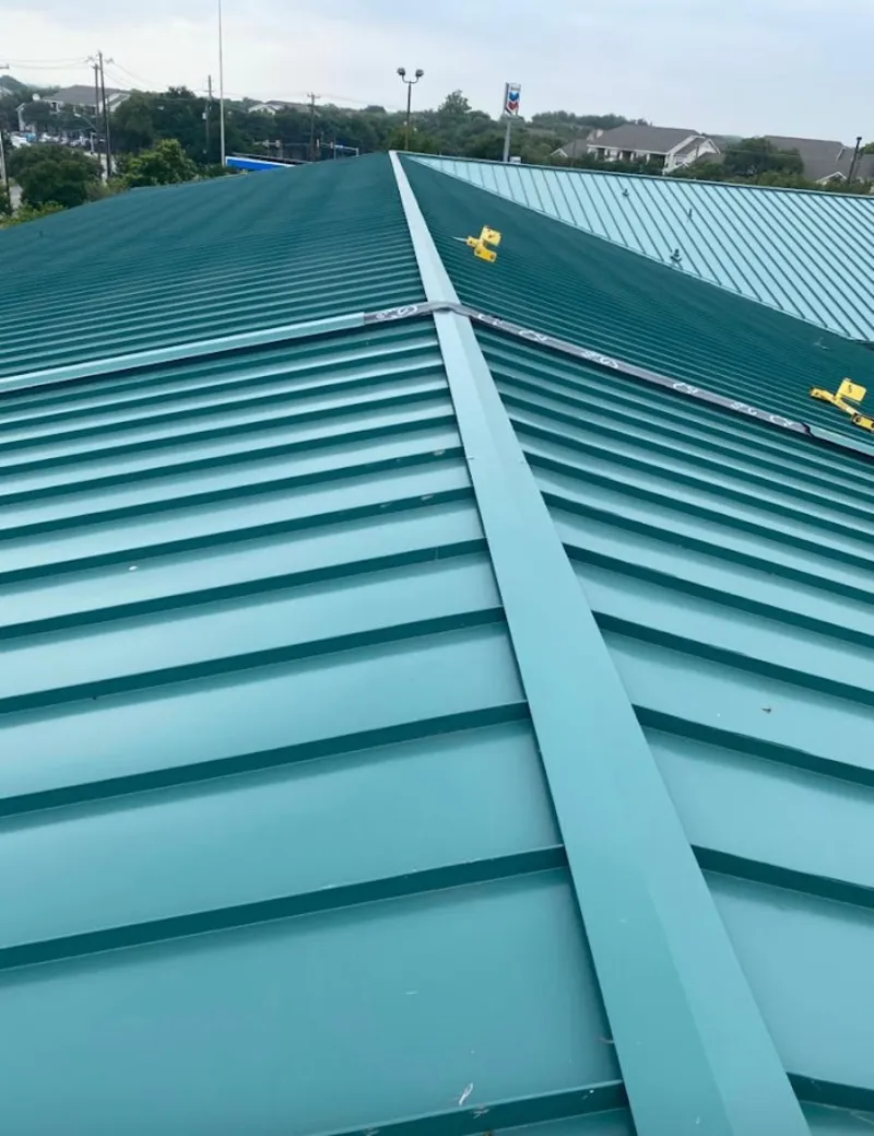 Green commercial metal roof ridge and valley for Metal Roof Repair in Rice Lake